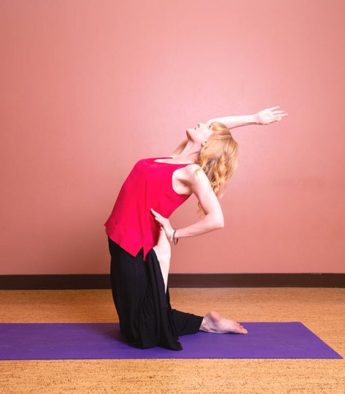 200-hr yoga teacher training with yogi in ustrasana one arm variation and leg in virasana